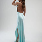 Elegant backless satin maxi dress in aqua blue with side slit and halter neckline — By Keara | Endless UAE