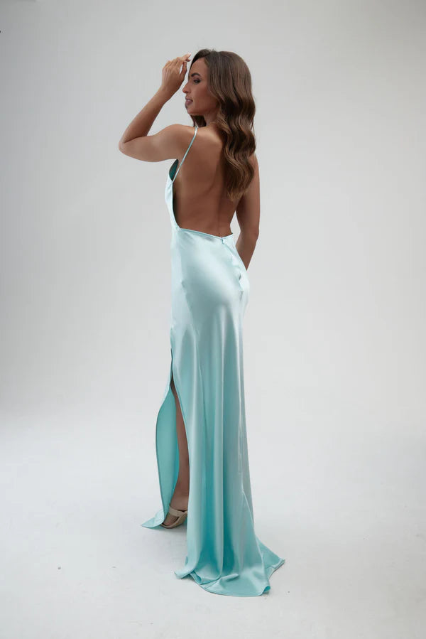 Elegant backless satin maxi dress in aqua blue with side slit and halter neckline — By Keara | Endless UAE