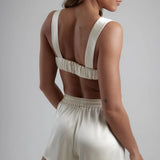 Ivory satin sculpted bralette with matching high-waisted shorts, shown from back view — By Keara | Endless UAE