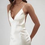 Elegant white satin backless dress with thin straps, deep V-neckline and side slit - By Keara | Endless UAE