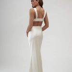Elegant ivory satin maxi skirt with high waist and floor-length silhouette, shown from back view — By Keara | Endless UAE