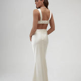 Elegant ivory satin maxi skirt with high waist and floor-length silhouette, shown from back view — By Keara | Endless UAE