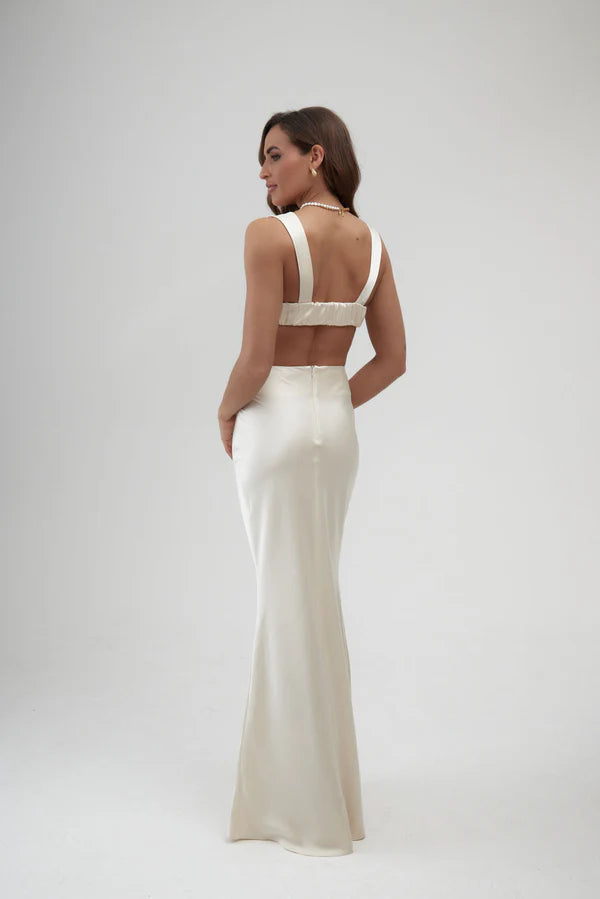 Elegant ivory satin maxi skirt with high waist and floor-length silhouette, shown from back view — By Keara | Endless UAE