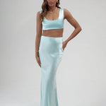 Light blue satin maxi skirt with pockets, full-length silhouette, elegant formal evening wear — By Keara | Endless UAE