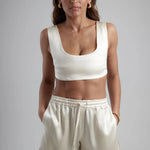 Ivory sculpted bralette with scoop neckline and wide straps paired with matching satin shorts — By Keara | Endless UAE