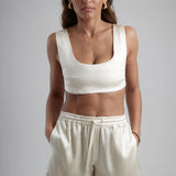 Ivory sculpted bralette with scoop neckline and wide straps paired with matching satin shorts — By Keara | Endless UAE