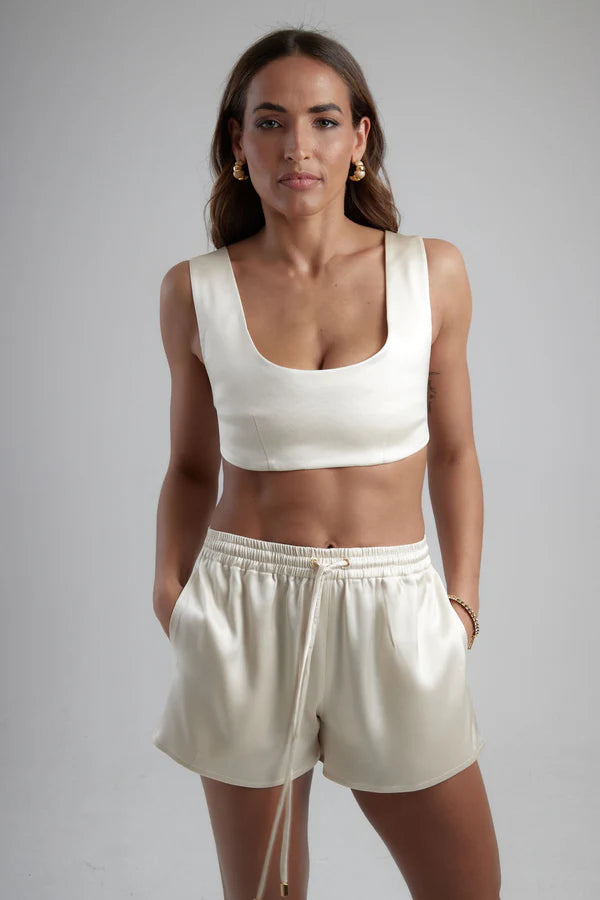 Ivory sculpted bralette with scoop neckline and wide straps paired with matching satin shorts — By Keara | Endless UAE