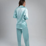 Light blue oversized shirt worn open over white crop top with matching pants — By Keara | Endless UAE