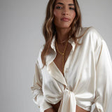 Cream tie-up shirt with gold chain necklace on model — By Keara | Endless UAE