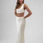 Elegant white satin maxi skirt with high waist and sleek silhouette, paired with matching crop top — By Keara | Endless UAE