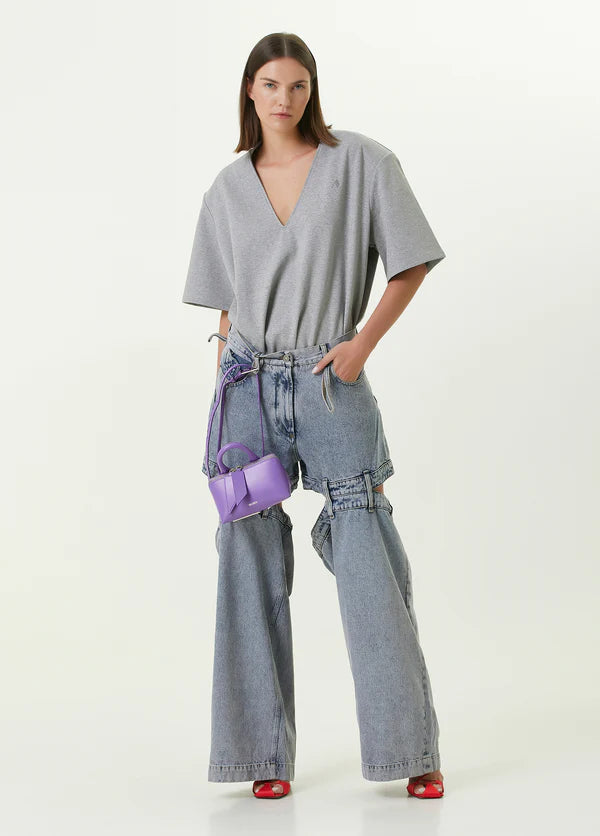 Ashton Cut-out Jeans in light blue denim with strategic knee and thigh cutouts — Attico | Endless UAE