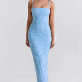 Blue floral embroidered maxi dress with thin straps on model sitting on chair — House of CB | Endless UAE