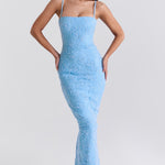 Blue floral embroidered maxi dress with thin straps on model sitting on chair — House of CB | Endless UAE