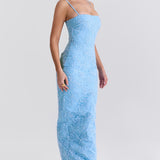 Blue floral embroidered maxi dress with thin straps on model sitting on chair — House of CB | Endless UAE