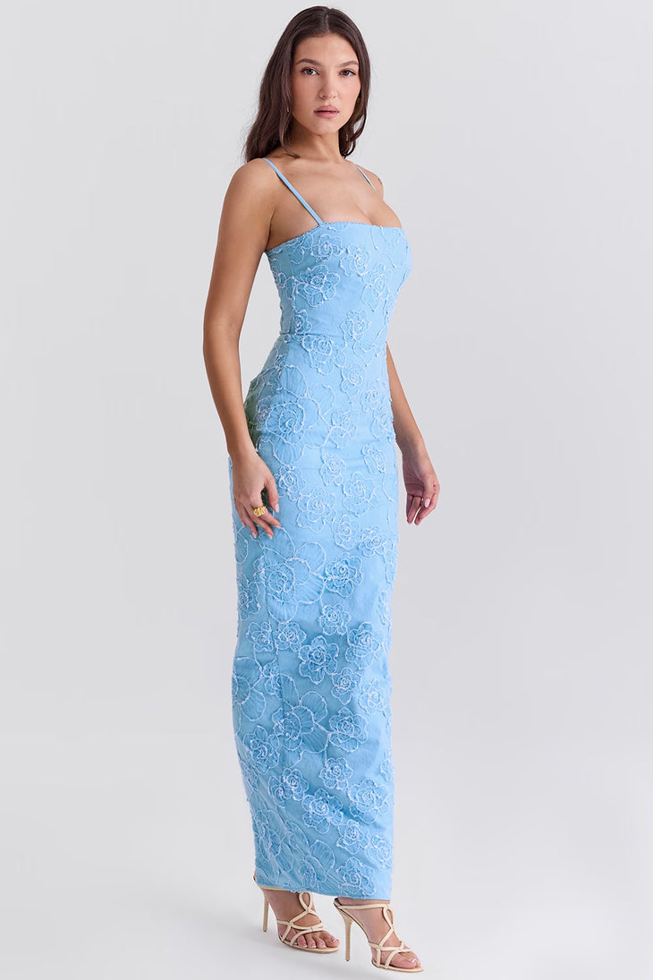 Blue floral embroidered maxi dress with thin straps on model sitting on chair — House of CB | Endless UAE