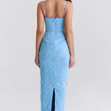 Blue floral embroidered maxi dress with thin straps on model sitting on chair — House of CB | Endless UAE