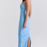 Blue floral embroidered maxi dress with thin straps on model sitting on chair — House of CB | Endless UAE