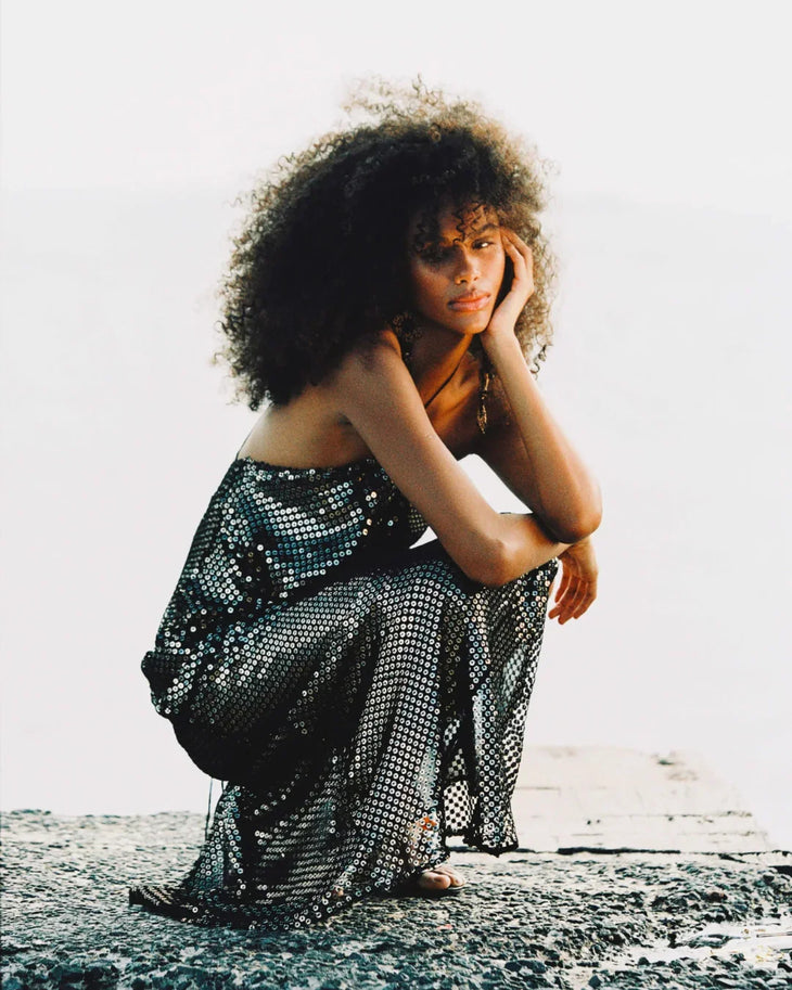 Black mesh halter maxi dress styled on beach with ocean backdrop — Rat & Boa | Endless UAE