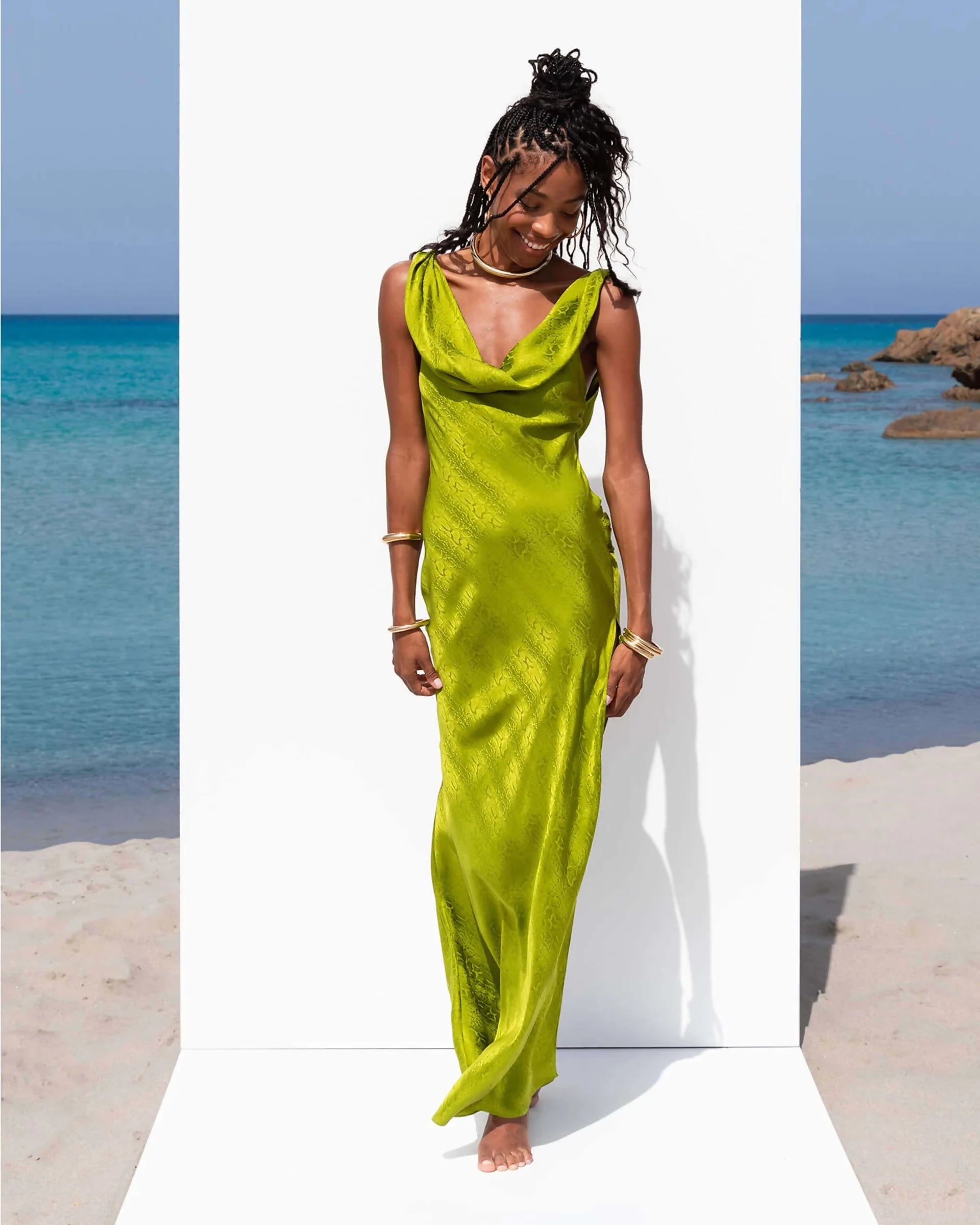 Lime green satin cowl neck maxi dress worn by model on beach setting — Rat and Boa | Endless UAE
