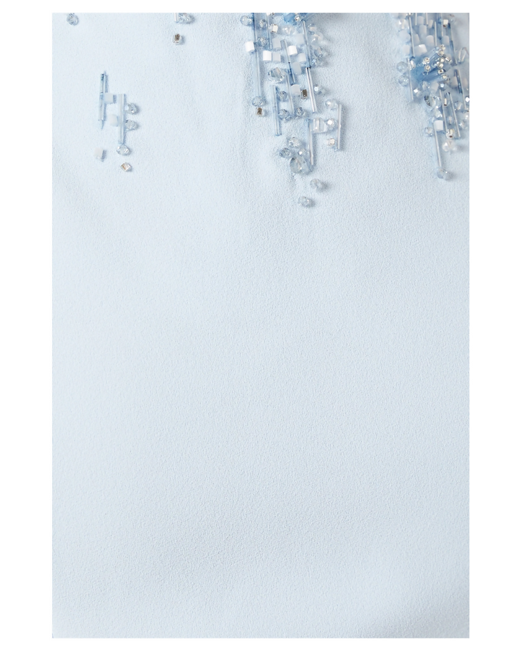Elegant white beaded off-shoulder dress with delicate crystal embellishments and intricate detailing on pristine fabric — Heva | Endless UAE