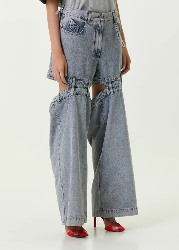 Ashton Cut-out Jeans in light blue denim with strategic knee and thigh cutouts — Attico | Endless UAE