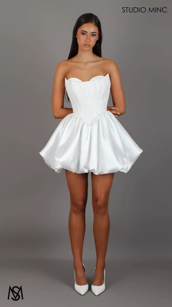 Woman wearing white strapless sweetheart neckline bubble hem mini dress — Studio Minc Australia | Endless UAE