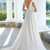 Off-shoulder white wedding dress with ruched bodice and flowing skirt — Justin Alexander | Endless UAE