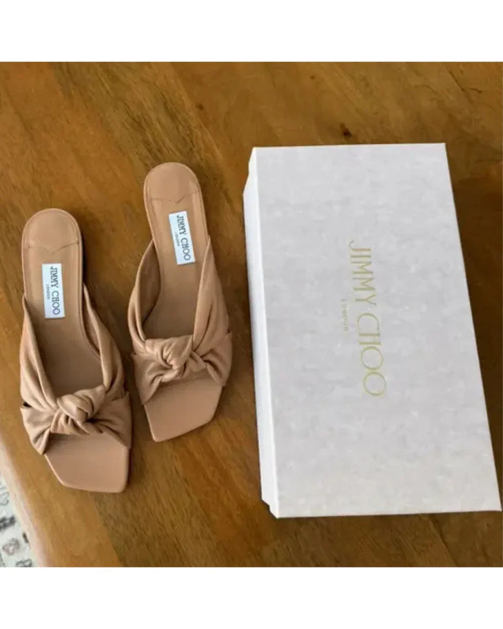 Beige leather flat sandal with twisted knot detail and black sole — Jimmy Choo | Endless UAE