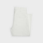 Folded white denim jeans with visible back pocket detail — Celine | Endless UAE