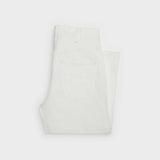 Folded white denim jeans with visible back pocket detail — Celine | Endless UAE