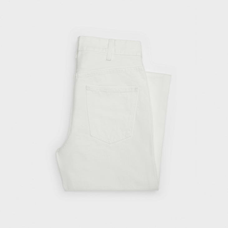 Folded white denim jeans with visible back pocket detail — Celine | Endless UAE
