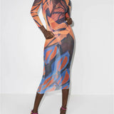 Sheer mesh maxi dress with vibrant orange and blue abstract print, long sleeves, and fitted silhouette — Louisa Ballou | Endless UAE