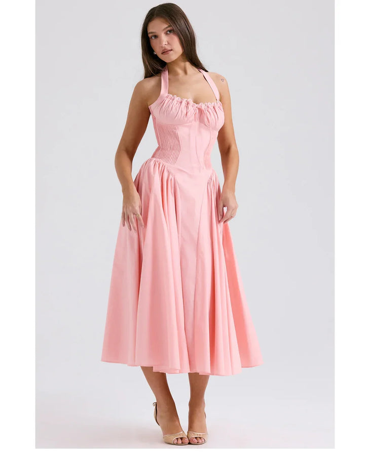 Woman wearing rose pink cotton halter midi sundress with ruched neckline and full skirt — House of CB | Endless UAE