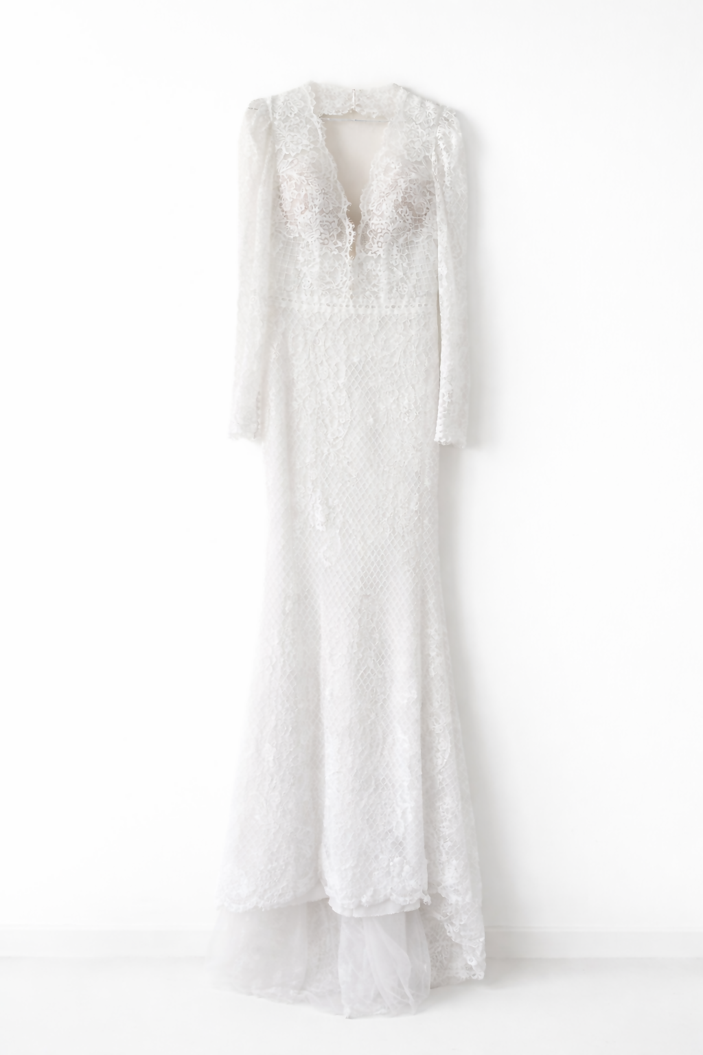Elegant white lace wedding dress with long sleeves and flowing tulle train — Tatiana Kaplun | Endless UAE