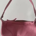 Pink leather mini shoulder bag with dual handles displayed against neutral background — By Far | Endless UAE