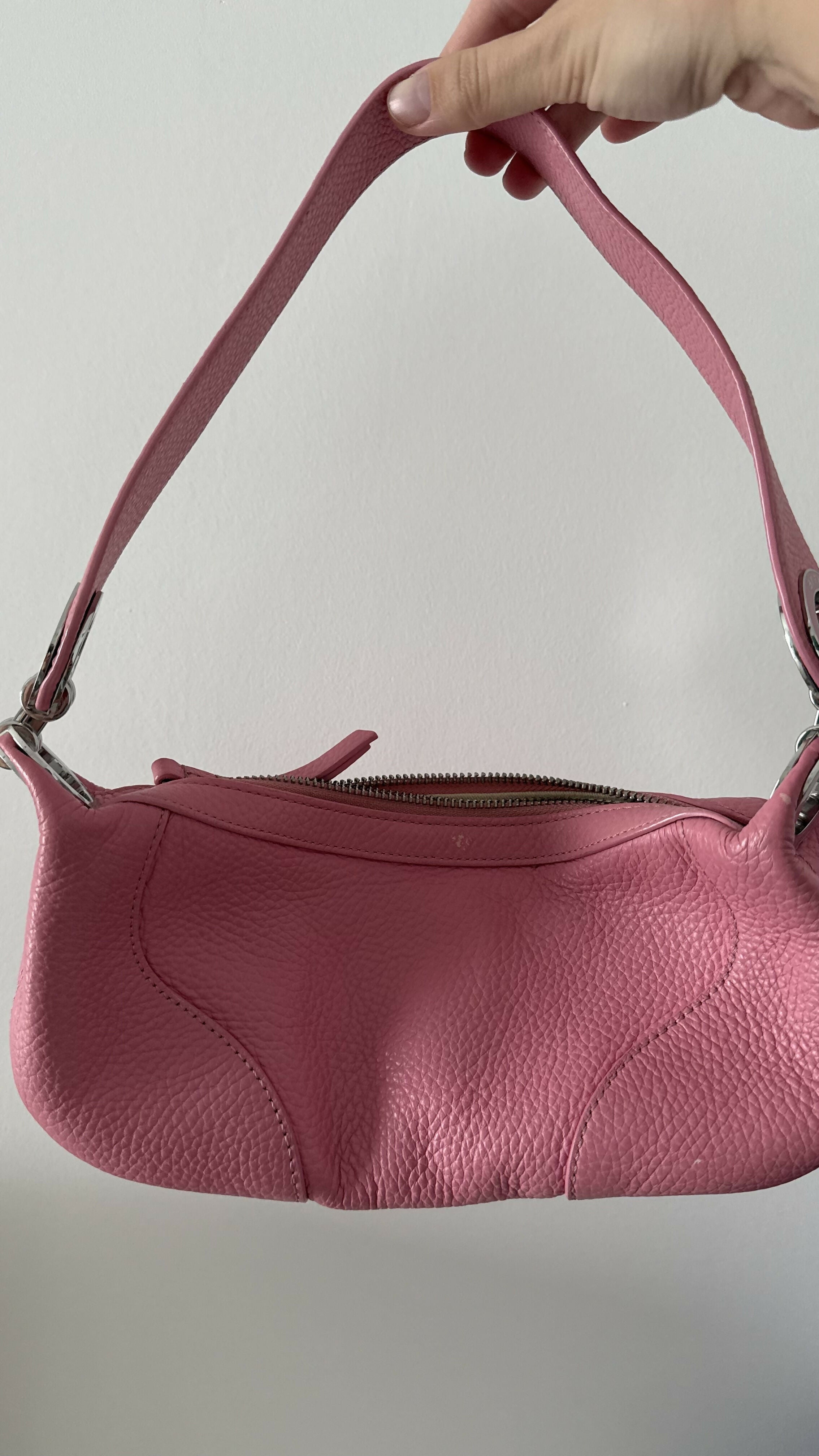 Pink leather mini shoulder bag with dual handles displayed against neutral background — By Far | Endless UAE
