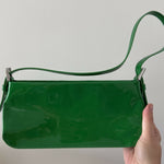 Dulce Patent Leather Shoulder Bag in vibrant green, held up against neutral background — By Far | Endless UAE