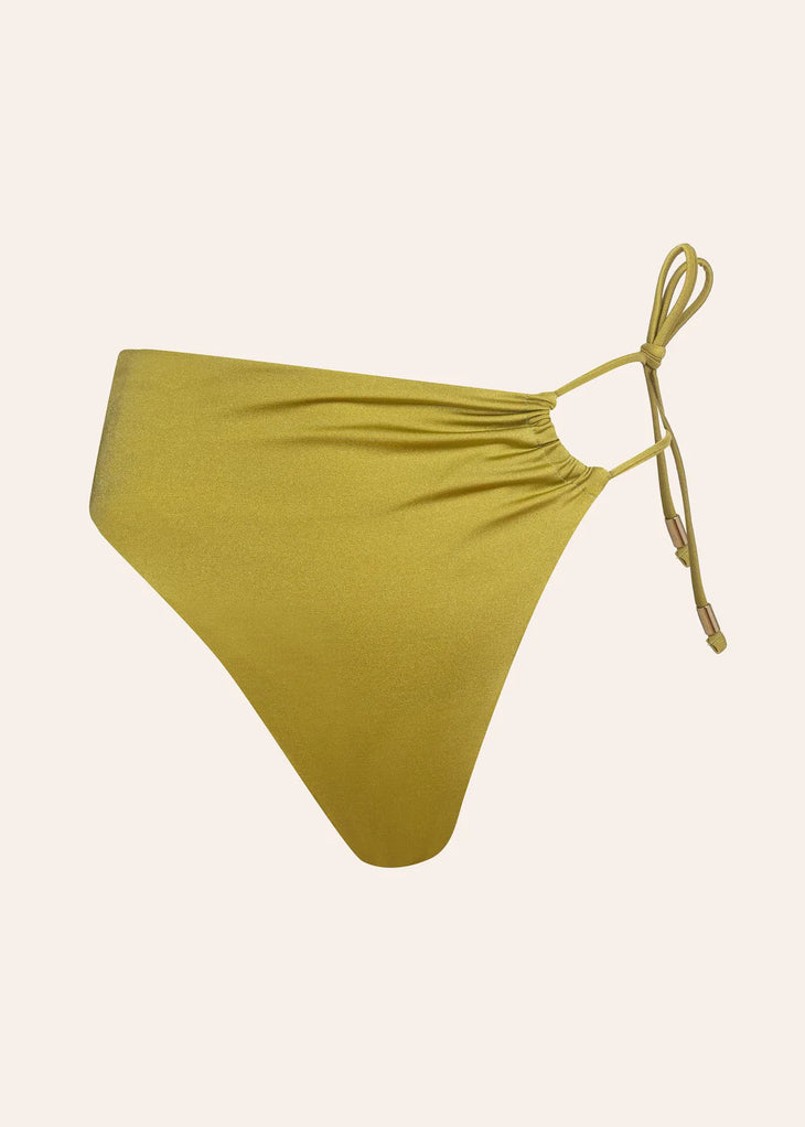 Heidi reversible green bikini bottom with side tie strings displayed flat on beige background — Dvete | Endless UAE