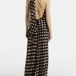 Black maxi dress with beige polka dots, featuring one-shoulder design and open back detail — Alexandra Miro | Endless UAE