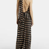 Black maxi dress with beige polka dots, featuring one-shoulder design and open back detail — Alexandra Miro | Endless UAE