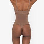 Woman wearing beige high waist thong in standing pose — Underhance | Endless UAE