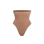 Woman wearing beige high waist thong in standing pose — Underhance | Endless UAE