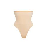 Woman wearing beige high waist thong in standing pose — Underhance | Endless UAE