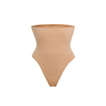 Woman wearing beige high waist thong in standing pose — Underhance | Endless UAE