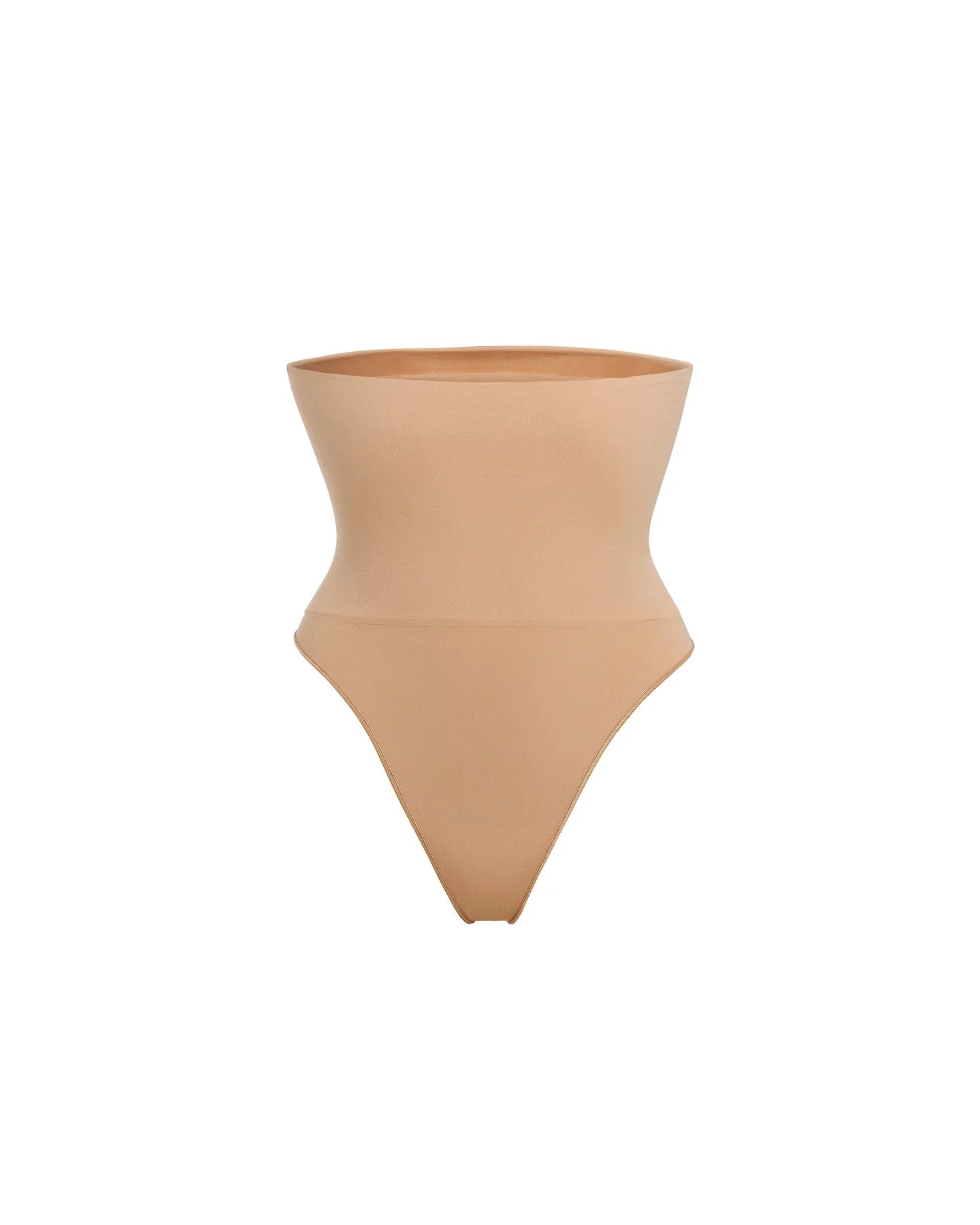 Woman wearing beige high waist thong in standing pose — Underhance | Endless UAE