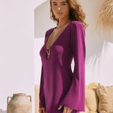 Purple metallic mini dress with plunging neckline and long sleeves in white Mediterranean setting — Beach City | Endless UAE