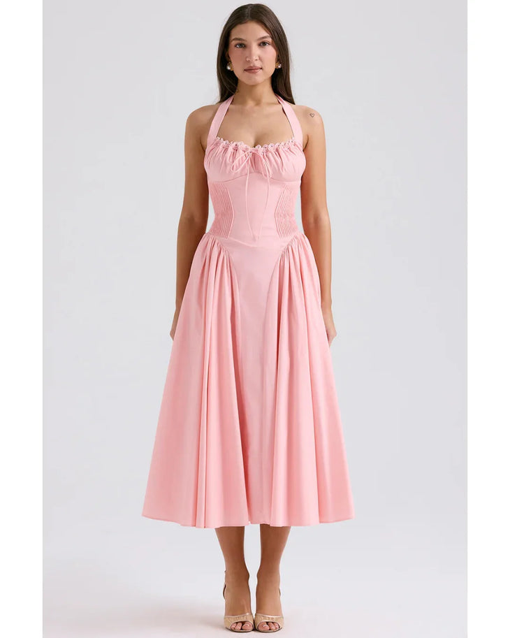 Woman wearing rose pink cotton halter midi sundress with ruched neckline and full skirt — House of CB | Endless UAE