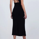 Black one-shoulder velvet midi dress with red quilted bag and gold heeled sandals — Misha | Endless UAE