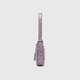 Mini Rachel Lilac Croco Embossed Leather Bag held in hand against white background — By Far | Endless UAE