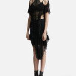 Black ruched dress with cold shoulder detail, sheer mesh panels, and asymmetric tulle hem worn with ankle boots — Ester Manas | Endless UAE